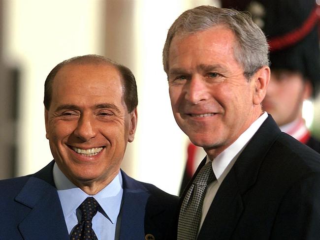 Former Italian prime minister Silvio Berlusconi with former US president George Bush in July 2001 prior to the first G-8 working session at Palazzo Ducale in Genoa. Picture: AFP