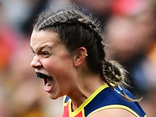 ADELAIDE, AUSTRALIA - MARCH 31: Anne Hatchard of the Adelaide Crows celebrates a goal with Hannah Martin of the Adelaide Crows and Justine Mules of the Adelaide Crows during the AFLW Grand Final match between the Adelaide Crows and the Carlton Blues at Adelaide Oval on March 31, 2019 in Adelaide, Australia. (Photo by Mark Brake/Getty Images)