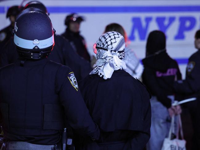 NYPD officers arrest students as they evict a building that had been barricaded by pro-Palestinian student protesters at Columbia University, in New York City. Picture: AFP