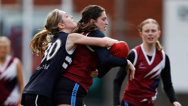 Rowville’s Charlotte Lorenz-Daniel is tackled by Ruby Reddrop. Picture: Getty.