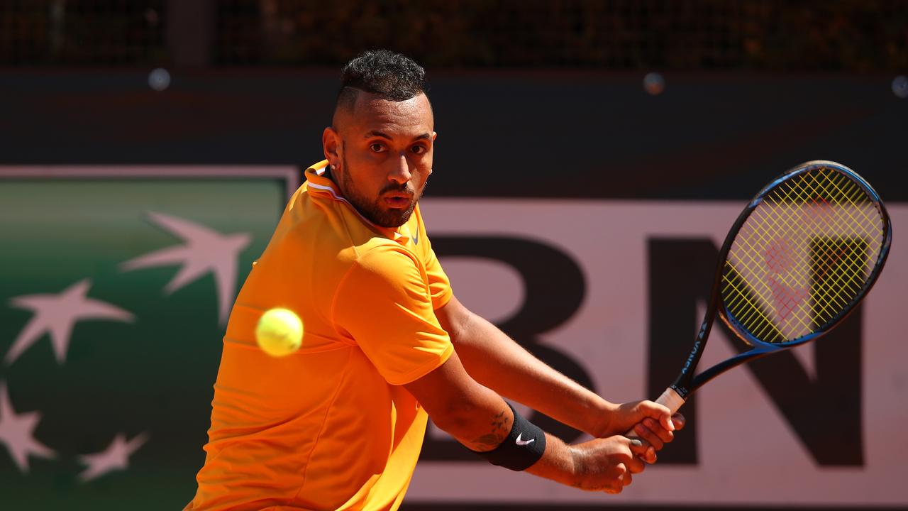 Nick Kyrgios plays a backhand against Casper Ruud.