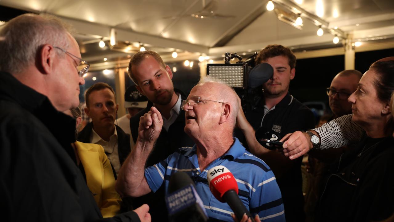 Scott Morrison is confronted in Edgeworth Tavern about the pension and the Commonwealth Integrity Commission. Picture: Damian Shaw/News Corp Australia