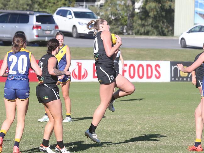 Tayla Gregory clunks a mark for Southport. Picture by Richard Gosling