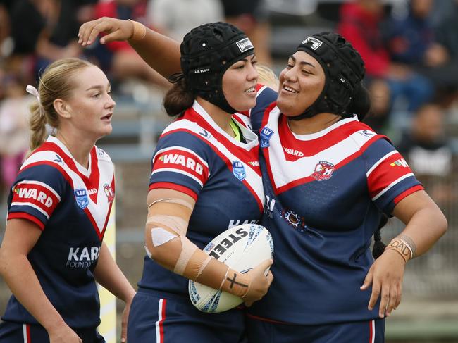 Aliyah Nasio (ball) is congratulated by Phoenix Lamese. Picture: Warren Gannon Photography.