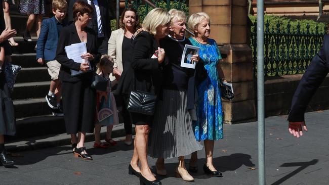 Mr Walsh’s sisters appeared distraught as they left the church on Monday. Picture: NCA NewsWire / Justin Lloyd