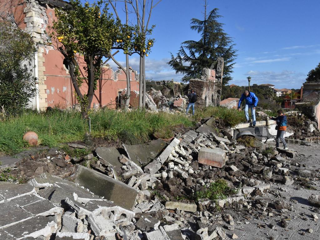 A quake triggered by Mount Etna’s ongoing eruption jolted eastern Sicily before dawn Wednesday, injuring 10 people, damaging churches and houses. Picture: ANSA/AP