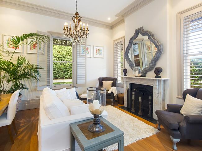 Marble fireplaces and French doors line the original sections of the home.