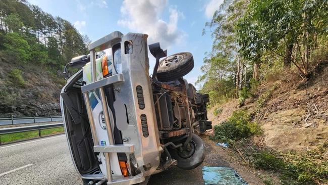 A truck rolled after it collided with a car on the Bruce Hwy southbound near the Kiel Mountain overpass.