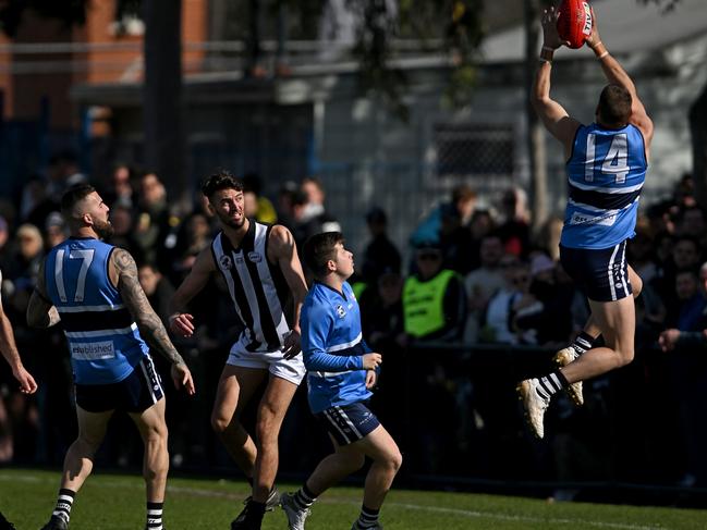 WRFL: Point Cook Centrals’ Mark Hanson flies for the mark. Picture: Andy Brownbill