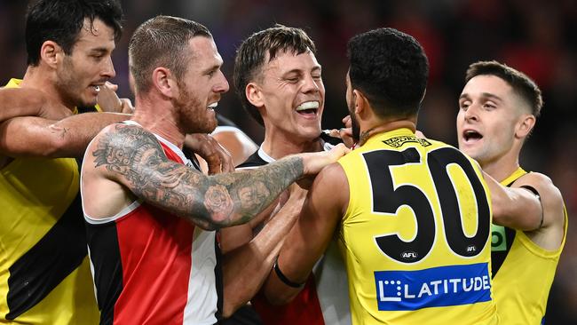 Marlion Pickett gets involved in a wrestle with Saints Tim Membrey and Jack Hayes after giving away an off-the-ball free kick. Picture: Quinn Rooney/Getty Images