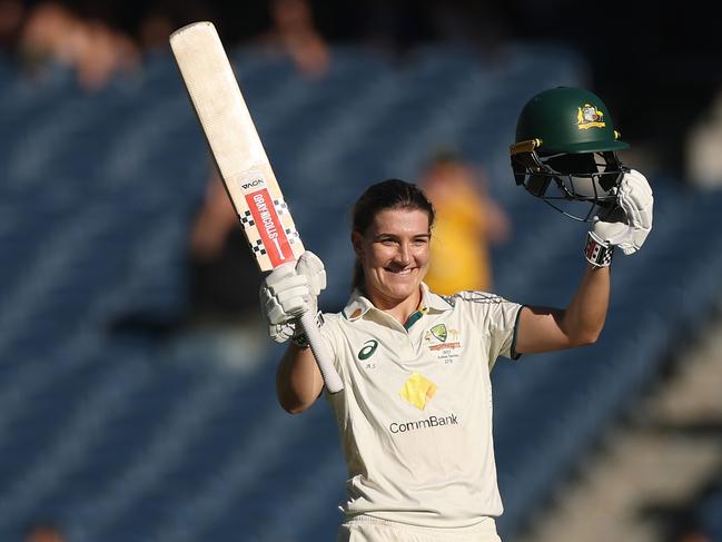 MELBOURNE, AUSTRALIA - JANUARY 31: Annabel Sutherland of Australia raises her bat after making a century during day two of the Women's Ashes Test Match between Australia and England at Melbourne Cricket Ground on January 31, 2025 in Melbourne, Australia. (Photo by Daniel Pockett/Getty Images)