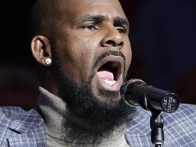 FILE - In this Nov. 17, 2015, file photo, musical artist R. Kelly performs the national anthem before an NBA basketball game between the Brooklyn Nets and the Atlanta Hawks in New York. As critics of the singer seek to cancel his shows because of his alleged mistreatment of women, a community leader in North Carolina says she and others will stage a protest if his Friday show in Greensboro takes place. (AP Photo/Frank Franklin II, File)