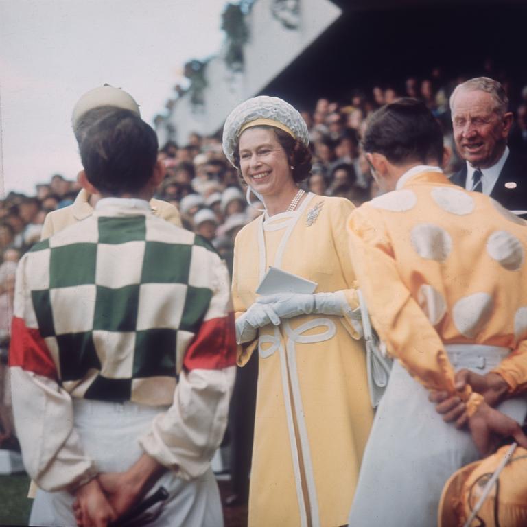 Queen Elizabeth II chats with jockeys Ron Quinton and Hilton Cope before the Queen Elizabeth Stakes at Randwick race course near Sydney, during her tour of Australia, 1st April 1970. Picture: Keystone/Hulton Archive/Getty Images