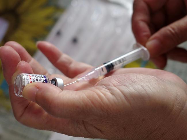 He received his first dose as required under the vaccine mandate. Picture: Bay Ismoyo/AFP