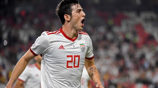 Iran's forward Sardar Azmoun celebrates after scoring a goal during the 2019 AFC Asian Cup Group D football match between Yemen and Iran at the Mohammed Bin Zayed stadium in Abu Dhabi on January 07, 2019. (Photo by Khaled DESOUKI / AFP)