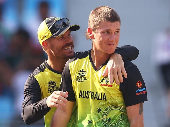 DUBAI, UNITED ARAB EMIRATES - NOVEMBER 04: Adam Zampa of Australia celebrates the wicket of Shoriful Islam of Bangladesh with team mate David Warner for their 5th wicket during the ICC Men's T20 World Cup match between Australia and Bangladesh at Dubai International Stadium on November 04, 2021 in Dubai, United Arab Emirates. (Photo by Michael Steele-ICC/ICC via Getty Images)