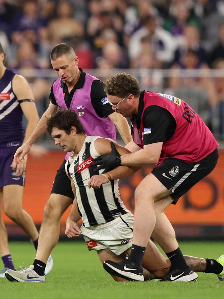 Lachie Schultz gets attended to after a brutal collision left him concussed. (Photo by Janelle St Pierre/AFL Photos via Getty Images)