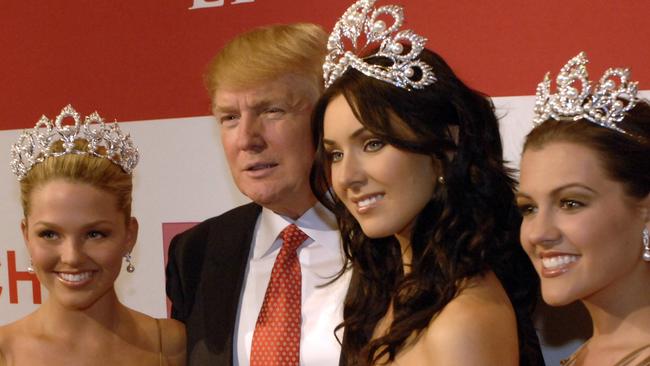 Donald J. Trump, then owner of the Miss Universe Organization, poses with Allie LaForce, Miss Teen USA 2005 left; Natalie Glebova, Miss Universe 2005, second from right and Chelsea Cooley, Miss USA 2005. Picture: AP