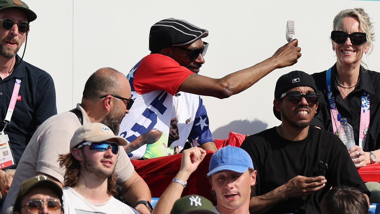 Snoop Dogg whipping out his (Temu?) fan. Picture: Arturo Holmes/Getty Images