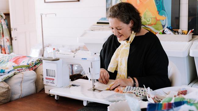 Sarah Stamm of Salisbury and Maude with her new quilt designs. Picture: Bec Haycraft