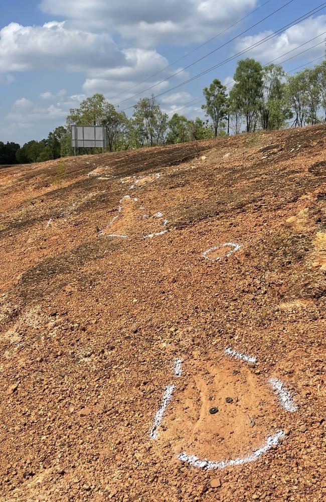 The investigation markings of a fatal motorcycle crash in Bees Creek stretch for about 100m on the side of the highway. Picture: Glenn Campbell