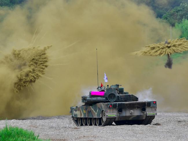 South Korea's K-1 tank fires smoke shells during a joint military drill last month. Picture: AFP/Jung Yeon-je