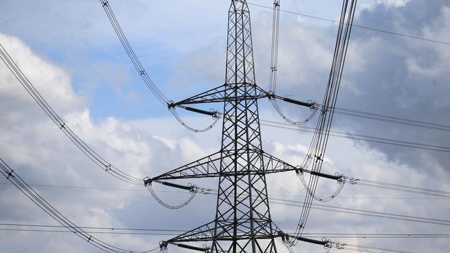 Electricity pylons hold power cables leading away from the SSE (Scottish and Southern Energy) gas-fired Keadby Power Station near Scunthorpe in northern England on September 6, 2022. - New UK Prime Minister Liz Truss inherits an economy set to enter recession before the end of the year, with double-digit inflation forecast to soar further. British households are facing an eye-watering 80-percent average hike in electricity and gas bills from next month, in a dramatic worsening of the cost-of-living crisis before winter. (Photo by Lindsey Parnaby / AFP)