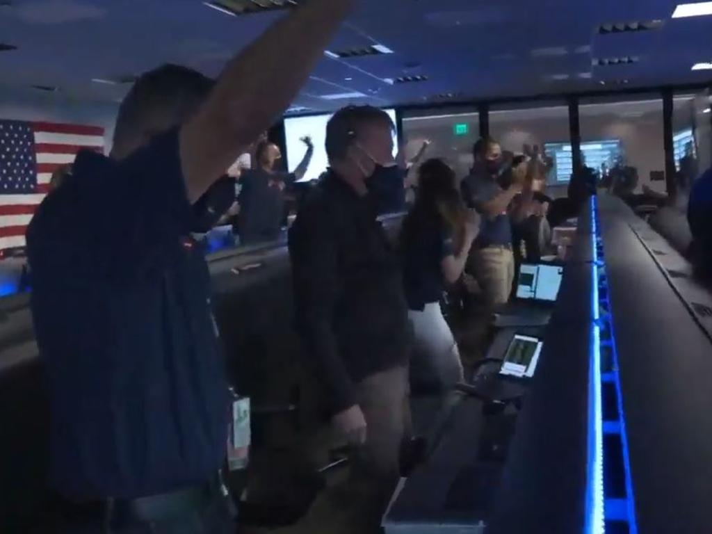 NASA crew celebrate upon confirmation the rover has touched down on Mars.