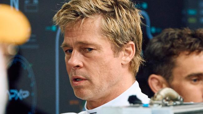 Hollywood actor Brad Pitt, acting in an upcoming Formula One-based movie, gets ready to film a scene on the set at the Silverstone motor racing circuit in Silverstone, central England, on July 5, 2024 ahead of the Formula One British Grand Prix. (Photo by BENJAMIN CREMEL / AFP)