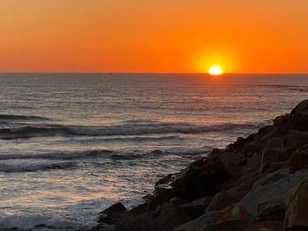 Sean Burke with the sunrise shot. Coffs cover image.