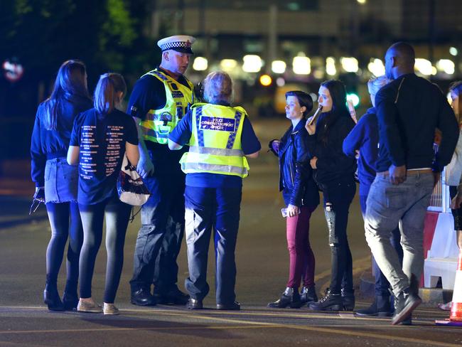 Police and fans close to the Manchester Arena after the blast. Picture: Getty