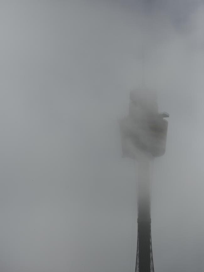 Fog covering Sydney Eye Tower as storms hit Sydney. Picture: Tim Pascoe