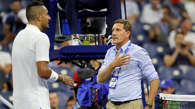 Nick Kyrgios discusses a ruling with tournament official Remy Azemar. Picture: Getty Images