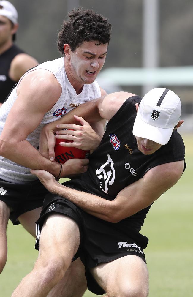 Darcy Byrne-Jones and Todd Marshall participate in a full-contact drill at training during the pre-season. Picture: Sarah Reed