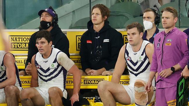 Nat Fyfe sits on the bench after being subbed from the match with a hamstring injury. Picture: Michael Willson/AFL Photos via Getty Images