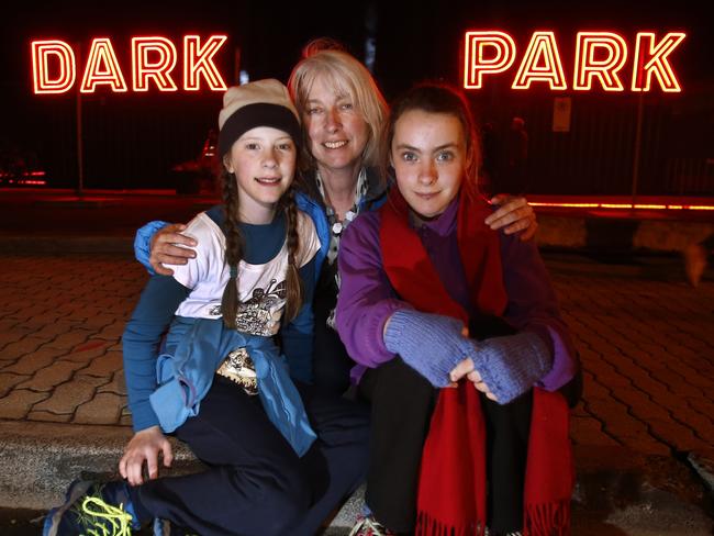 At the Dark Park opening night are Heather Horne, of West Moonah, with her daughters Maia, left, and Holly.