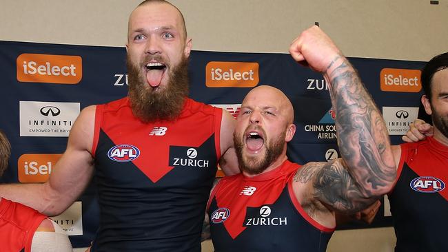 Nathan Jones sings the song with Max Gawn after the win. Picture: Getty