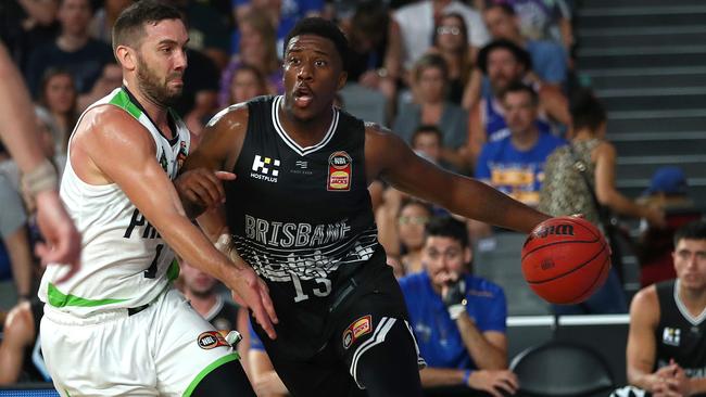 Lamar Patterson of the Bullets drives past Adam Gibson of the Phoenix on Saturday night. Picture: Getty Images