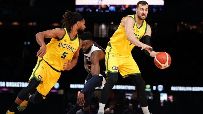 Bogut passes to Patty Mills during the Boomers’ win over Team USA. Pic: AAP