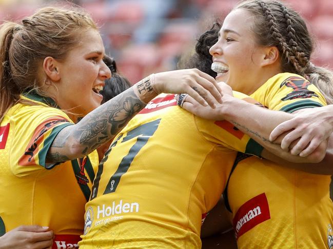 Isabelle Kelly of the Jillaroos celebrates a try with team-mates in action during the Womanâ€™s Rugby League World Cup final between Australia and New Zealand at Suncorp Stadium in Brisbane, Saturday, December 2, 2017. (AAP Image/Glenn Hunt) NO ARCHIVING, EDITORIAL USE ONLY