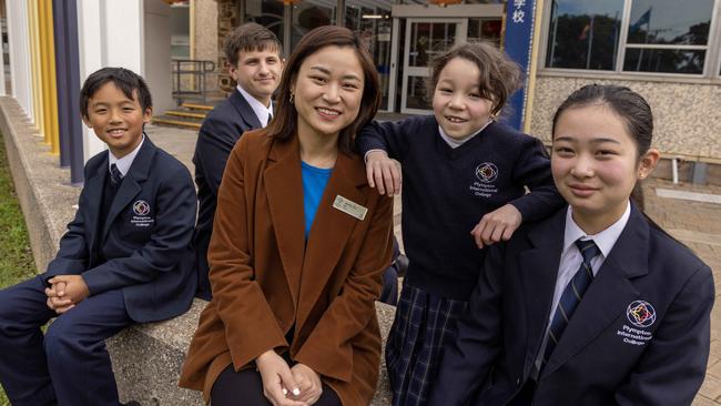 Plympton International bilingual program co-ordinator Jenny Xu, with year 4 student Ethan Taing, 9, year 11 student Keith longworth 16, year two pupil Madelyn Cormack, 7 and year 9 pupil Jiayu Lin, 14. They all say their school has a wonderful culture. Picture: Kelly Barnes