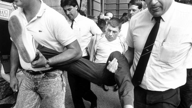 Victor Peirce being taken into court in 1988.