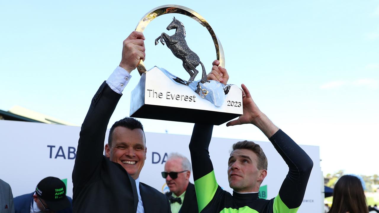 Jockey Sam Clipperton (right) and trainer Joe Pride hold aloft The Everest trophy after Think About It’s victory last year. Picture: Jeremy Ng / Getty Images