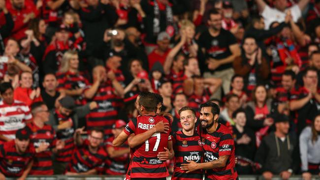 Fans and players erupt after the Wanderers secured a spot in the A-League grand final.