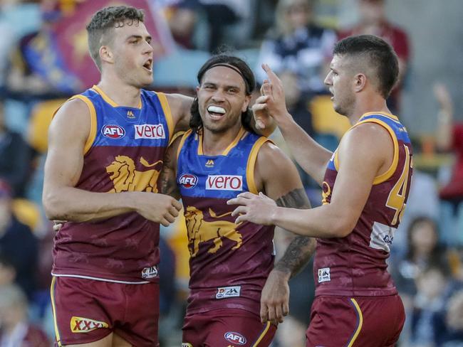 Tom Cutler of the Lions (left) celebrates a goal during the Round 16 AFL match between the Brisbane Lions and the Carlton Blues at the Gabba in Brisbane, Saturday, July 7, 2018. (AAP Image/Glenn Hunt) NO ARCHIVING, EDITORIAL USE ONLY