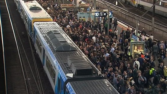 Commuters cram on to a platform at Southern Cross railway station. Picture: Channel 7/Twitter