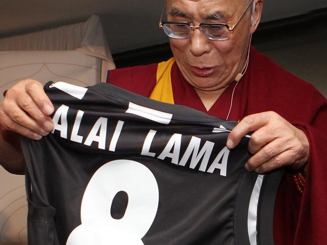 His Holiness the Dalai Lama was presented with a Collingwood football and jumper by Harry O'Brien during a Melbourne visit.