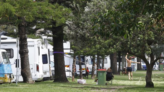 People in caravans and vans are taking advantage of free parking spots and setting up camp on Burleigh Esplanade. Picture: Tertius Pickard