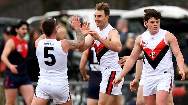 Tim “Bull’’ Smith of South Belgrave is congratulated by teammates after kicking a goal on Saturday. Photo by Josh Chadwick