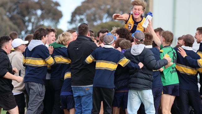 James Harvey's Echuca United teammates and supporters mob him after his clever left-foot snap.